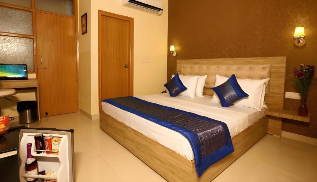 Postel nebo postele na pokoji v ubytování Hotel Oakwood