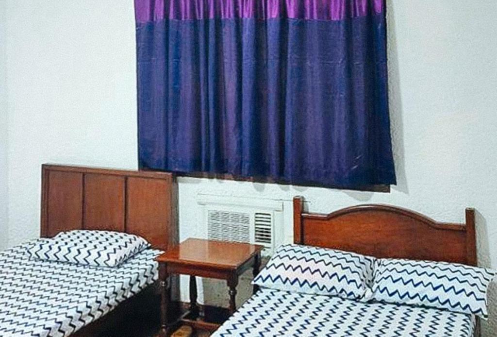 Postel nebo postele na pokoji v ubytování RedDoorz Hostel Hardin De Corales La Union