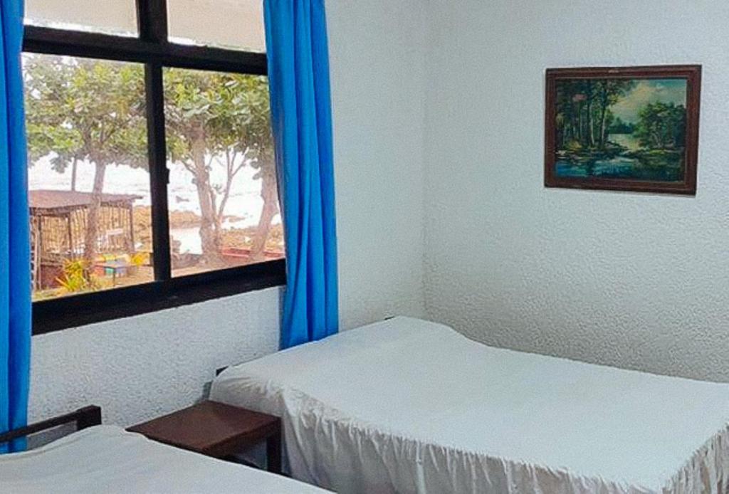 Postel nebo postele na pokoji v ubytování RedDoorz Hostel Hardin De Corales La Union