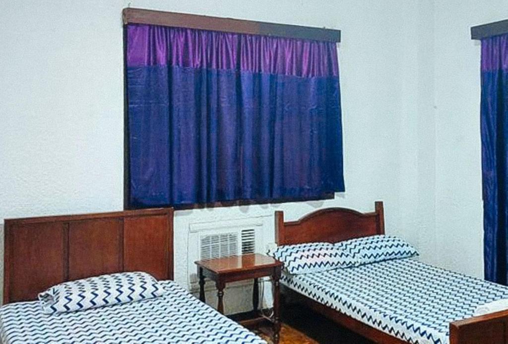 Postel nebo postele na pokoji v ubytování RedDoorz Hostel Hardin De Corales La Union