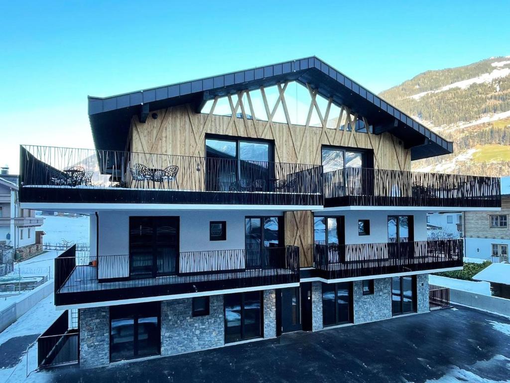 a building with balconies on the side of it at Chalet in Zillertal near Ski Slopes & Whirlpool in Aschau