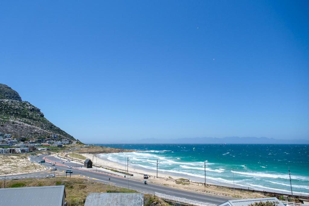 a view of a beach and the ocean at Bayside Cottage in Cape Town