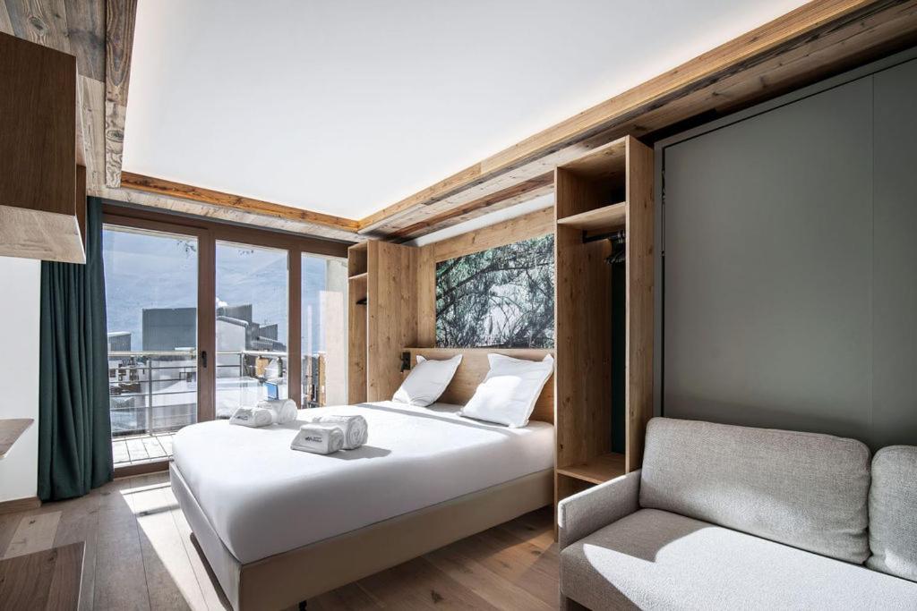 Giường trong phòng chung tại Chalet Hôtel Quartz