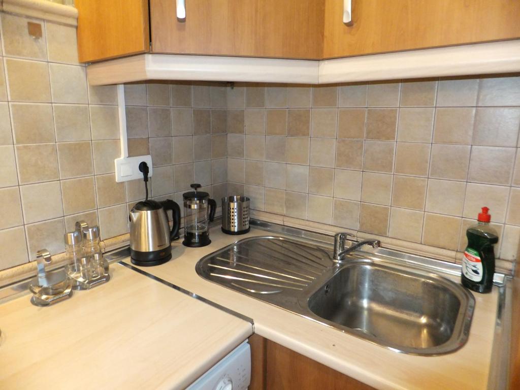 Kuchyňa alebo kuchynka v ubytovaní Apartamento Bahia Dorada