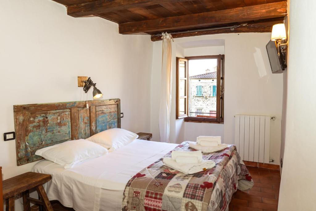 Posteľ alebo postele v izbe v ubytovaní B&B Luna & Stelle