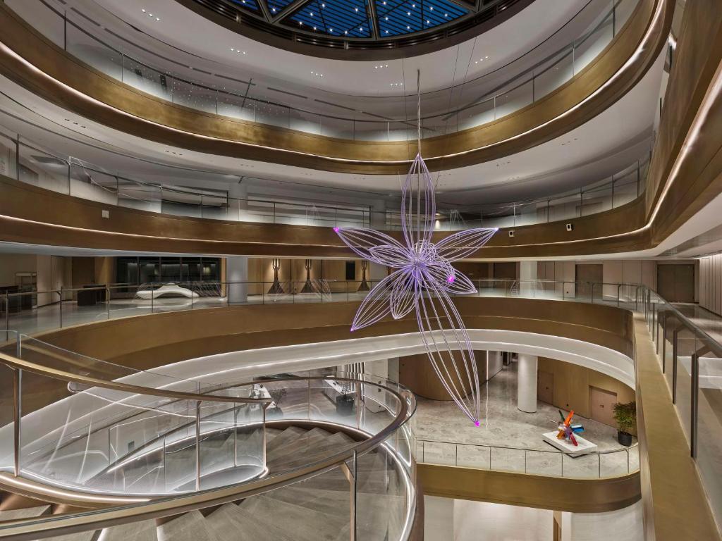 a spiral staircase in a building with a christmas ornament at Hilton Shanghai Hongqiao International Airport in Shanghai