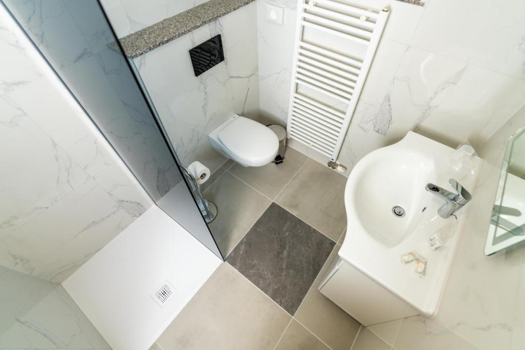 Koupelna v ubytování Hotel Center Bohinjsko Jezero