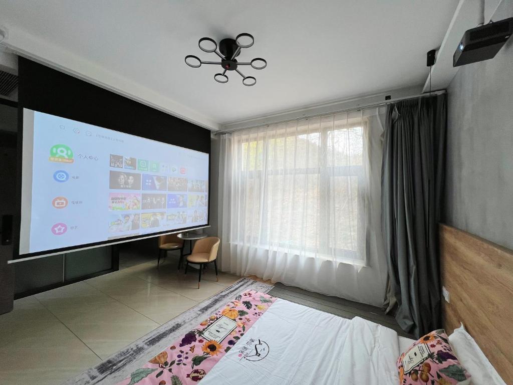 Ein Bett oder Betten in einem Zimmer der Unterkunft Mutianyu Great Wall Jingshan First House Boutique B&B