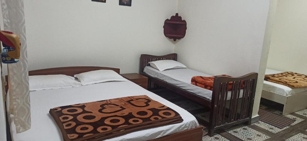 Postel nebo postele na pokoji v ubytování Prakruti Home stay