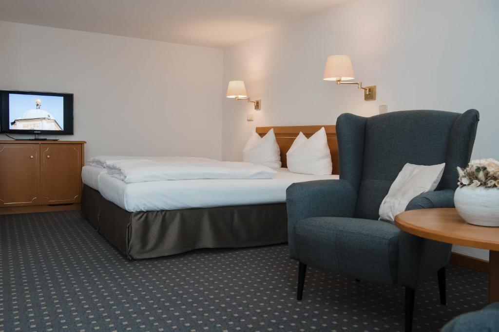 Postel nebo postele na pokoji v ubytování Hotel Alekto