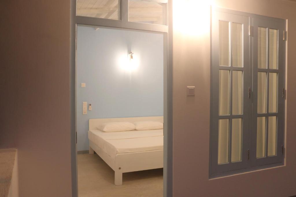 Postel nebo postele na pokoji v ubytování A.V.N HOMESTAY