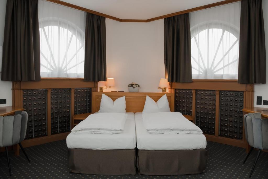 Postel nebo postele na pokoji v ubytování Hotel Alekto