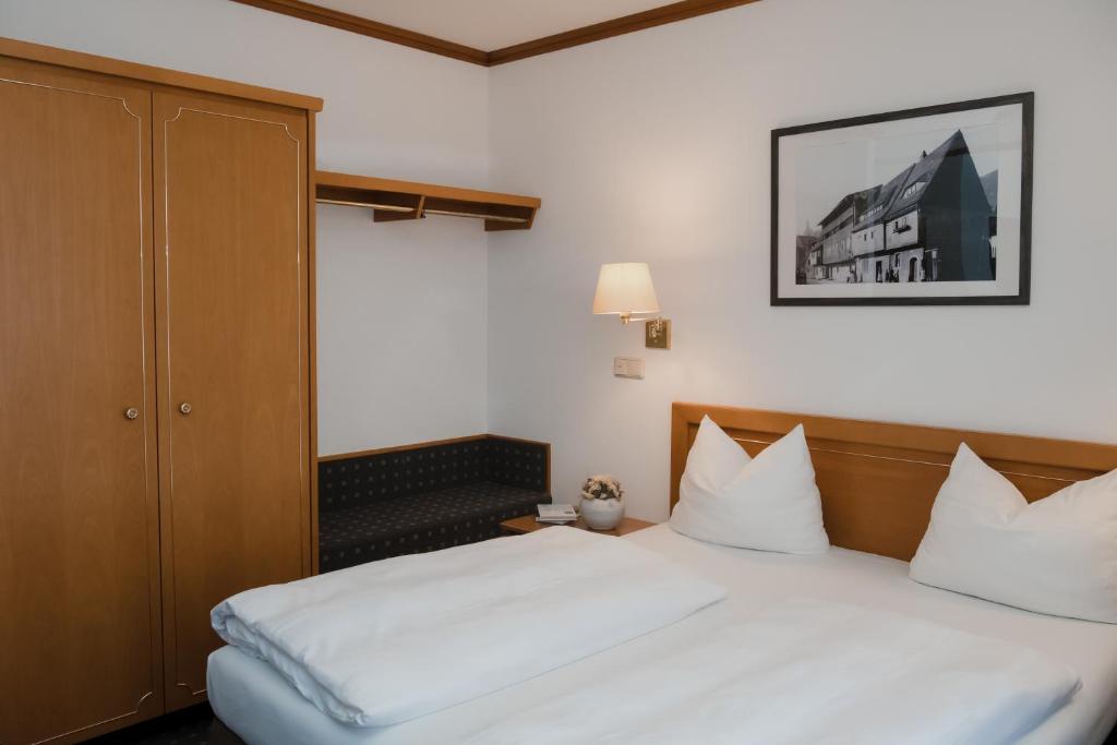 Postel nebo postele na pokoji v ubytování Hotel Alekto