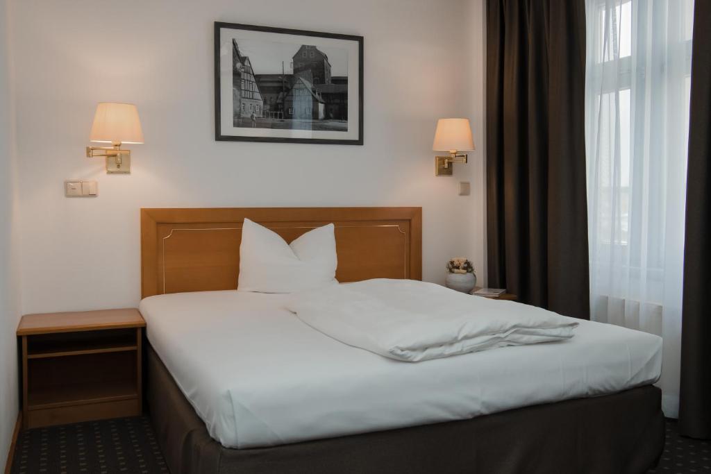 Postel nebo postele na pokoji v ubytování Hotel Alekto