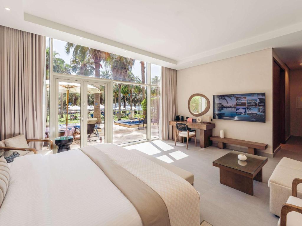 Ein Bett oder Betten in einem Zimmer der Unterkunft Rixos The Palm Hotel &amp; Suites - Ultra All Inclusive