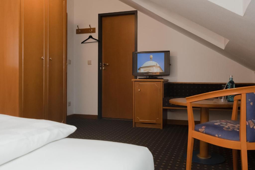 Postel nebo postele na pokoji v ubytování Hotel Alekto
