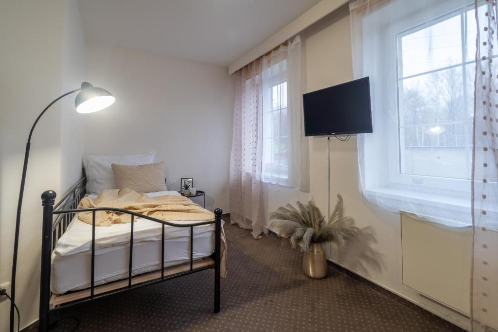 Postel nebo postele na pokoji v ubytování Hotel Garni Orlova