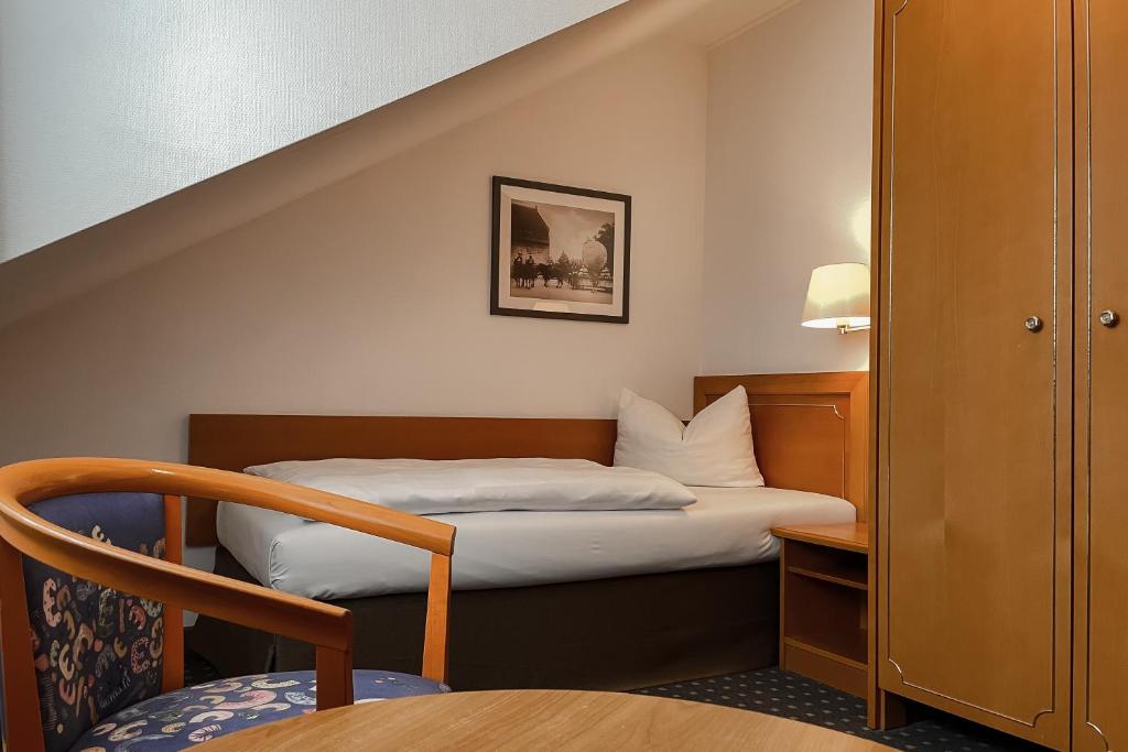 Postel nebo postele na pokoji v ubytování Hotel Alekto