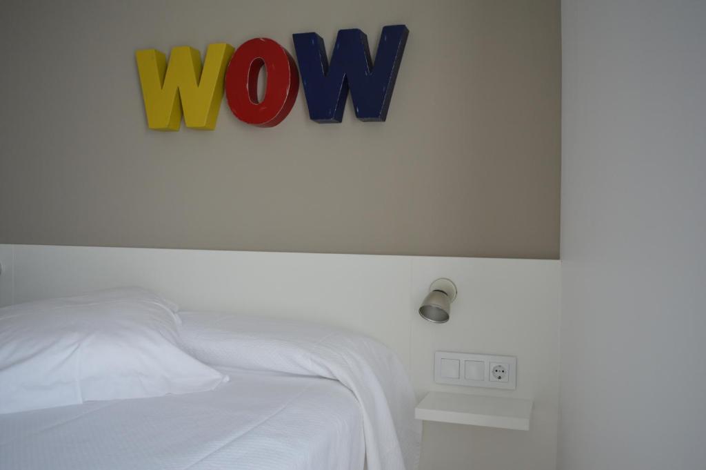 Postel nebo postele na pokoji v ubytování Hotel Nou Estrelles