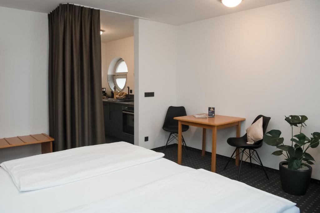 Postel nebo postele na pokoji v ubytování Hotel Alekto