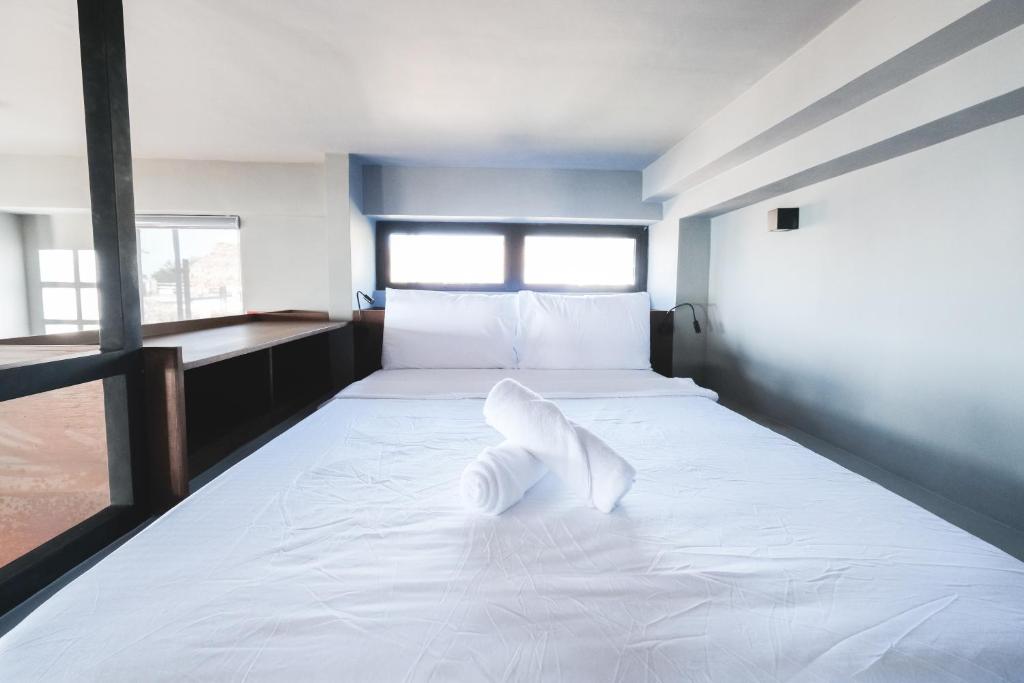 Postel nebo postele na pokoji v ubytování Terrace Suite