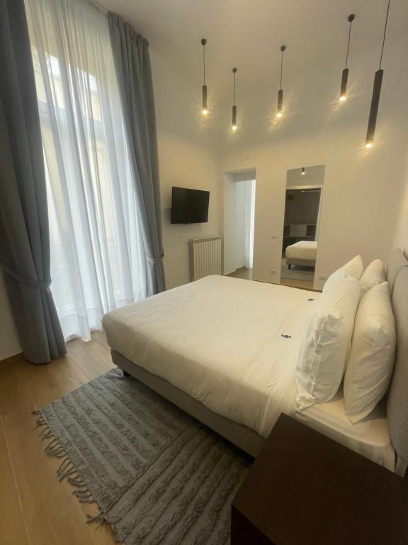 Łóżko lub łóżka w pokoju w obiekcie 4heavens_naples