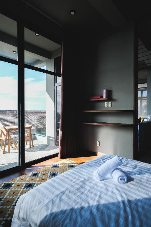 Postel nebo postele na pokoji v ubytování Terrace Suite