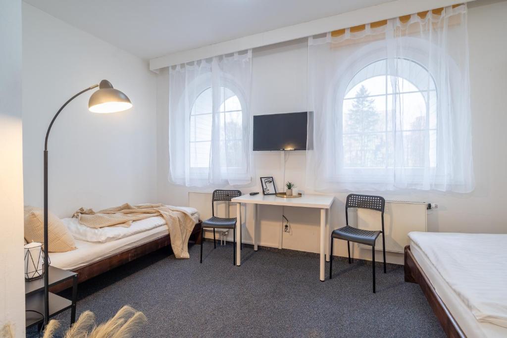 Postel nebo postele na pokoji v ubytování Hotel Garni Orlova