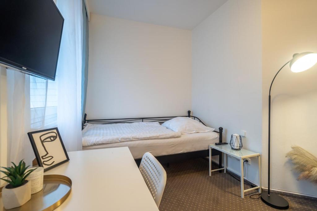 Postel nebo postele na pokoji v ubytování Hotel Garni Orlova