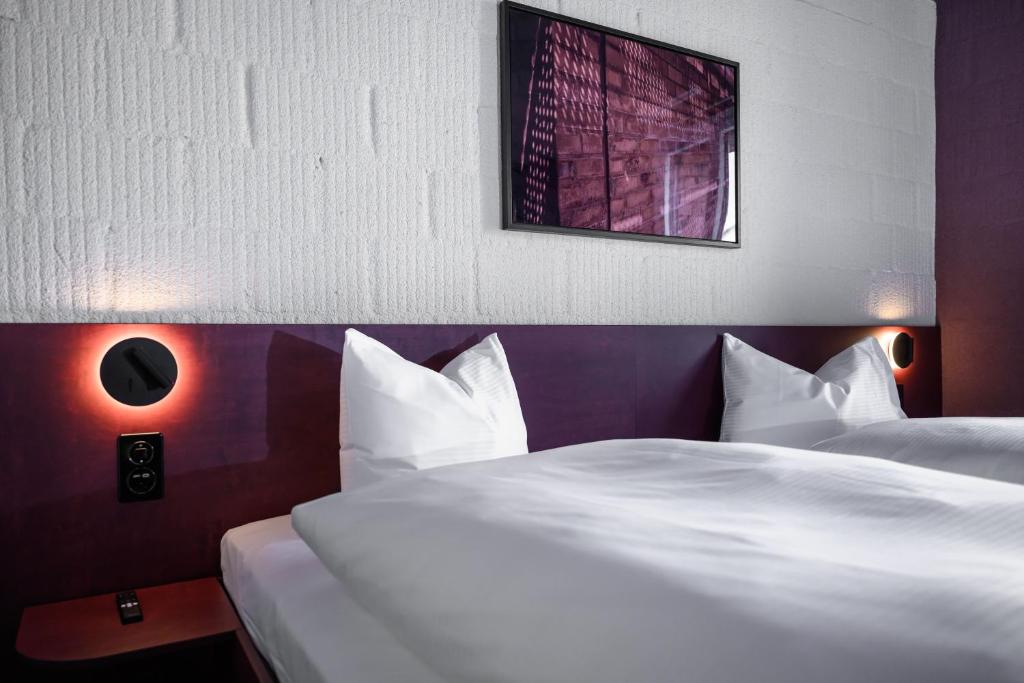 Letto o letti in una camera di BRIX - Self Check-In Hotel