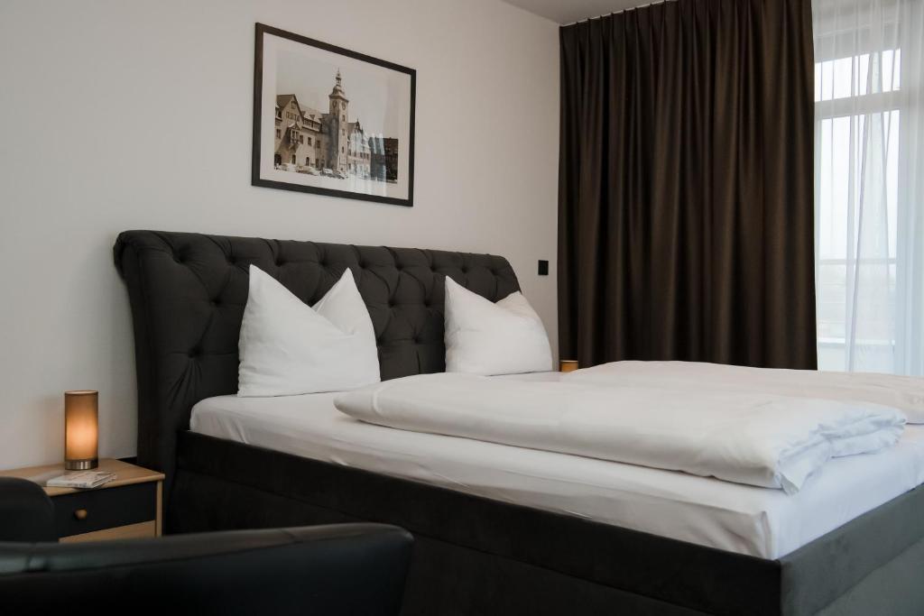 Postel nebo postele na pokoji v ubytování Hotel Alekto