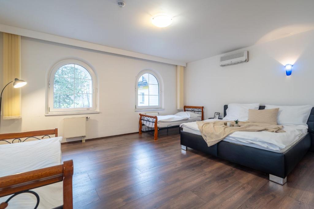 Postel nebo postele na pokoji v ubytování Hotel Garni Orlova