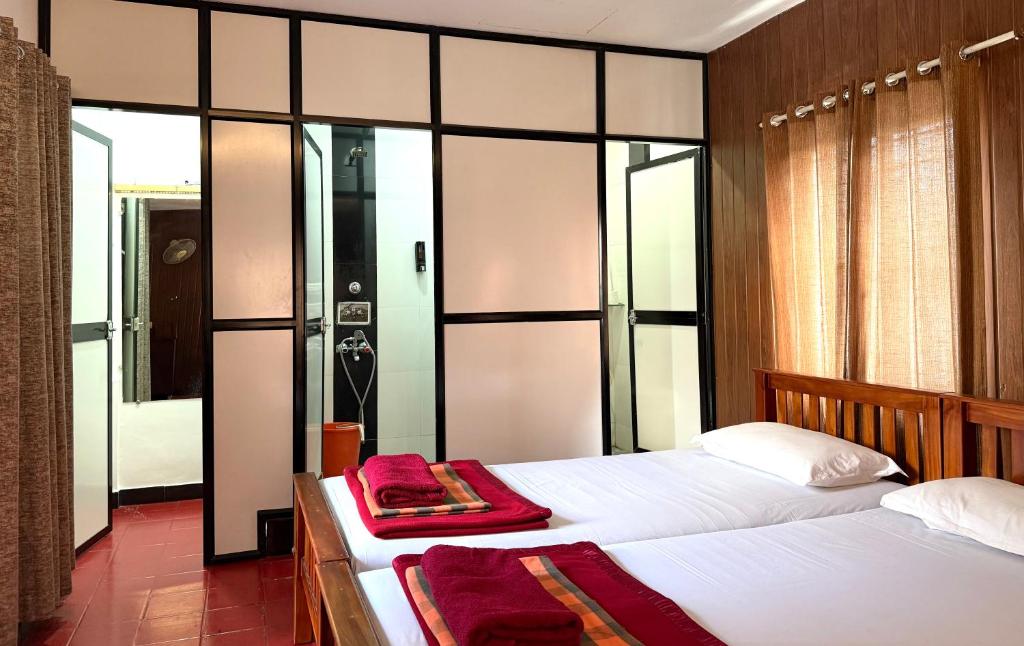 Postel nebo postele na pokoji v ubytování Reds Residency - Homestay