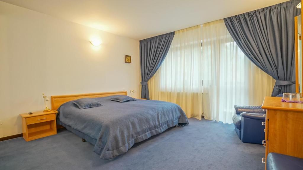 Letto o letti in una camera di Silvia Chalet Poiana Brasov