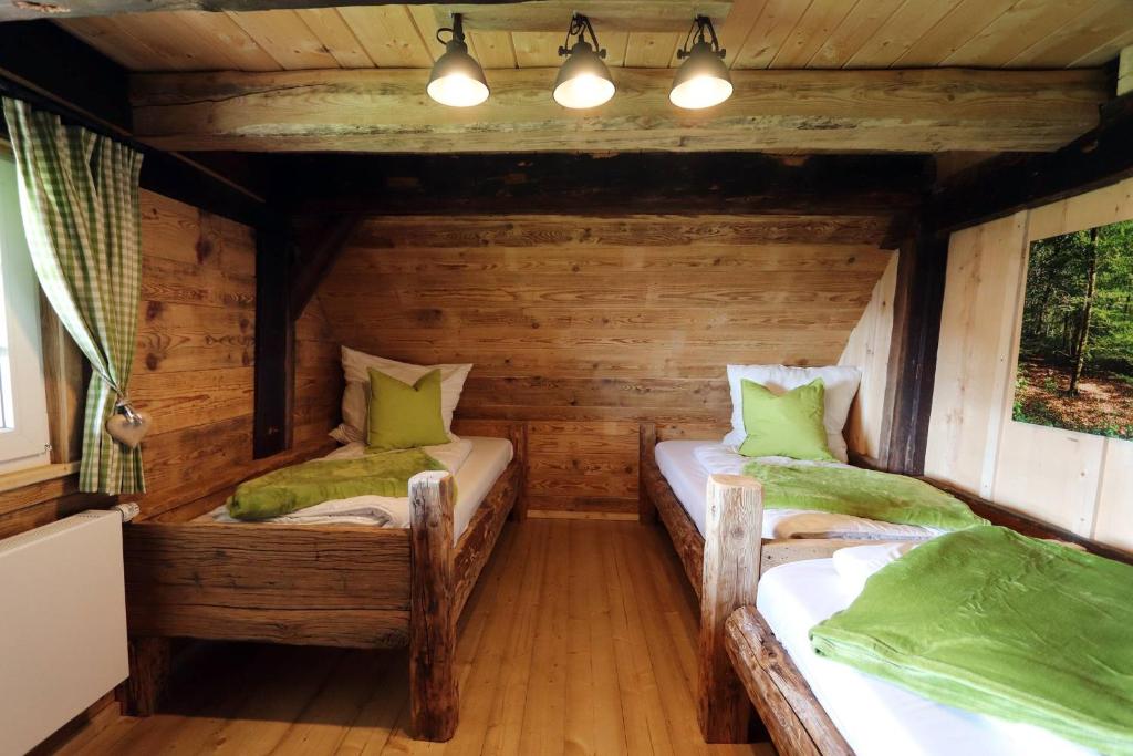 Postel nebo postele na pokoji v ubytování Ferienhütte Biobetrieb Lippenhof