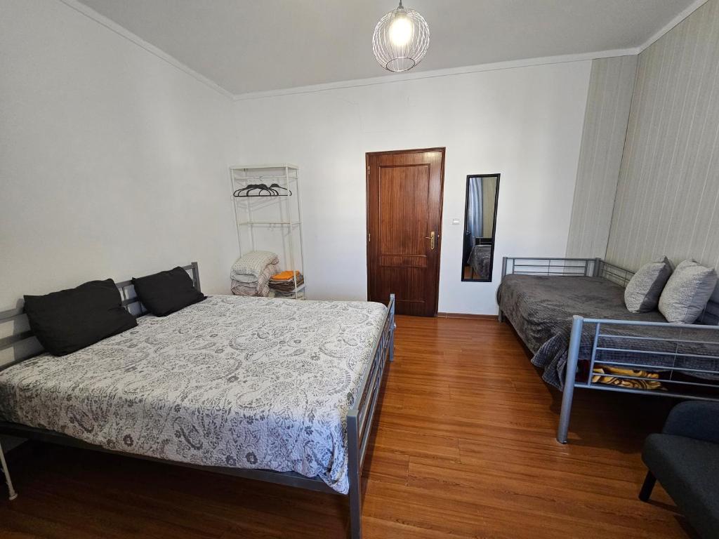 Postel nebo postele na pokoji v ubytování Aguarela Tavira