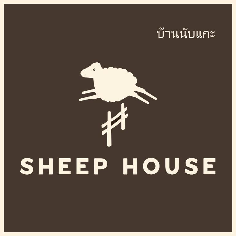 a white sign with a sheep on top at Sheep House บ้านนับแกะ in Ban Don Rak