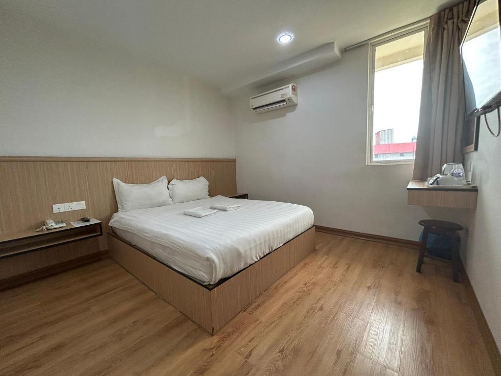Postel nebo postele na pokoji v ubytování Mint Hotel