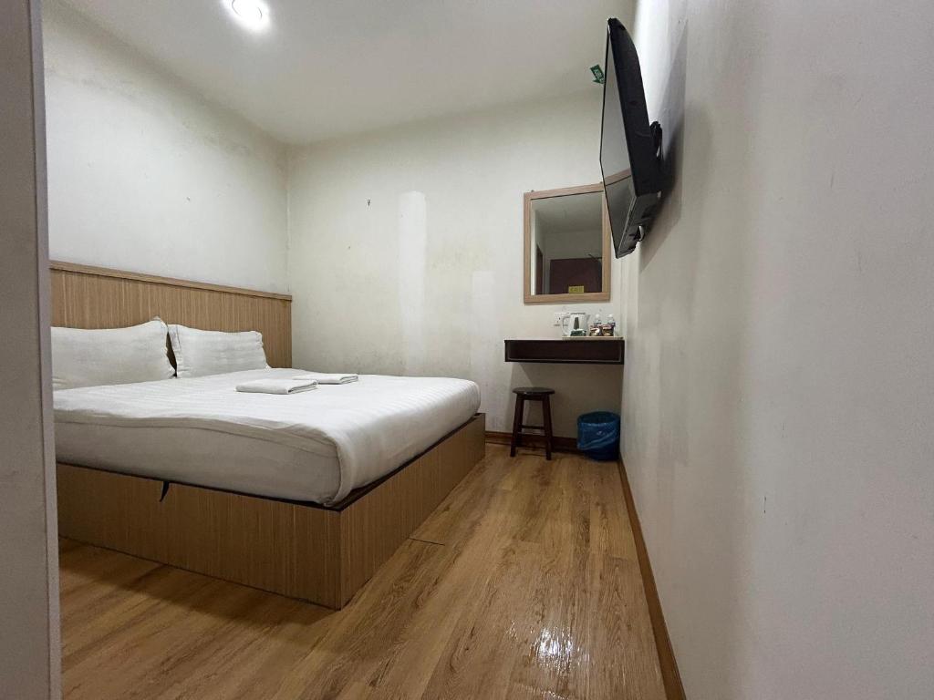 Postel nebo postele na pokoji v ubytování Mint Hotel