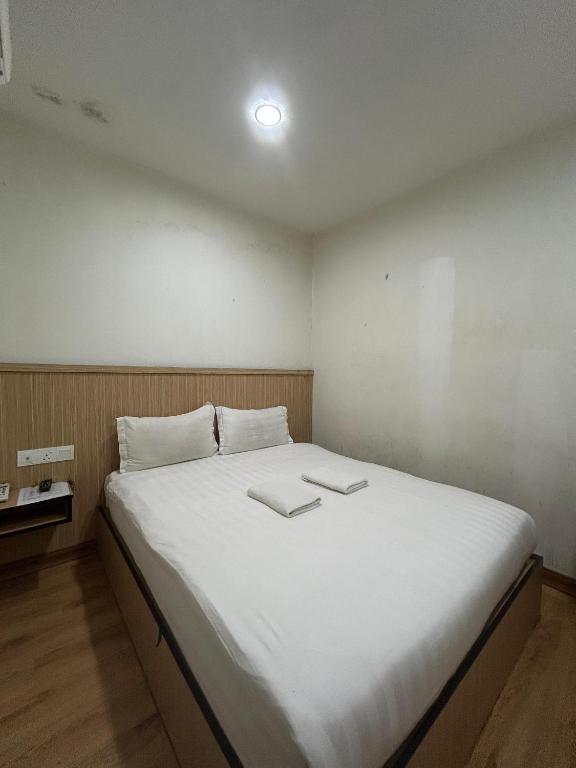 Postel nebo postele na pokoji v ubytování Mint Hotel