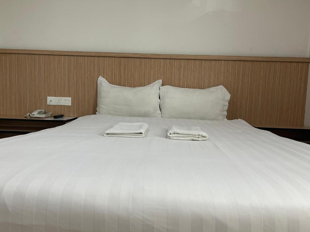 Postel nebo postele na pokoji v ubytování Mint Hotel