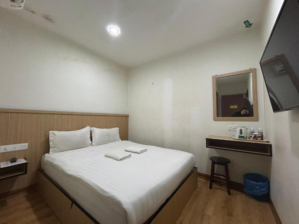Postel nebo postele na pokoji v ubytování Mint Hotel