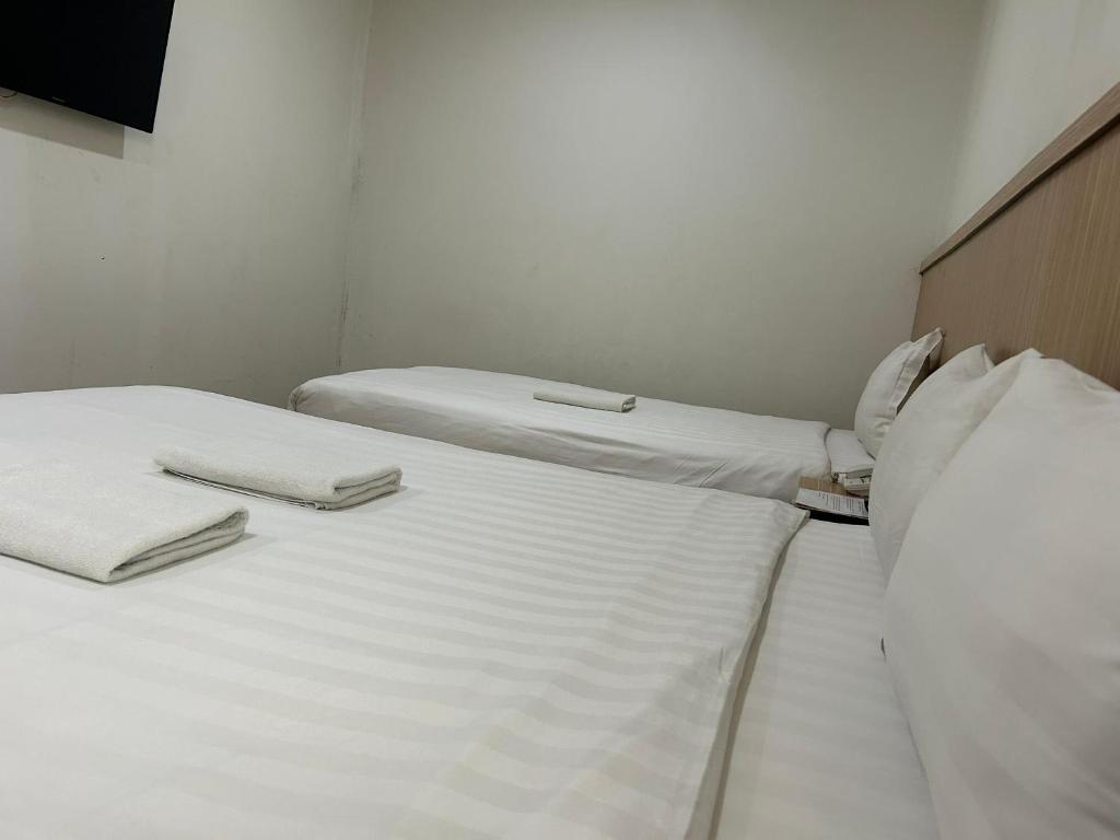 Postel nebo postele na pokoji v ubytování Mint Hotel