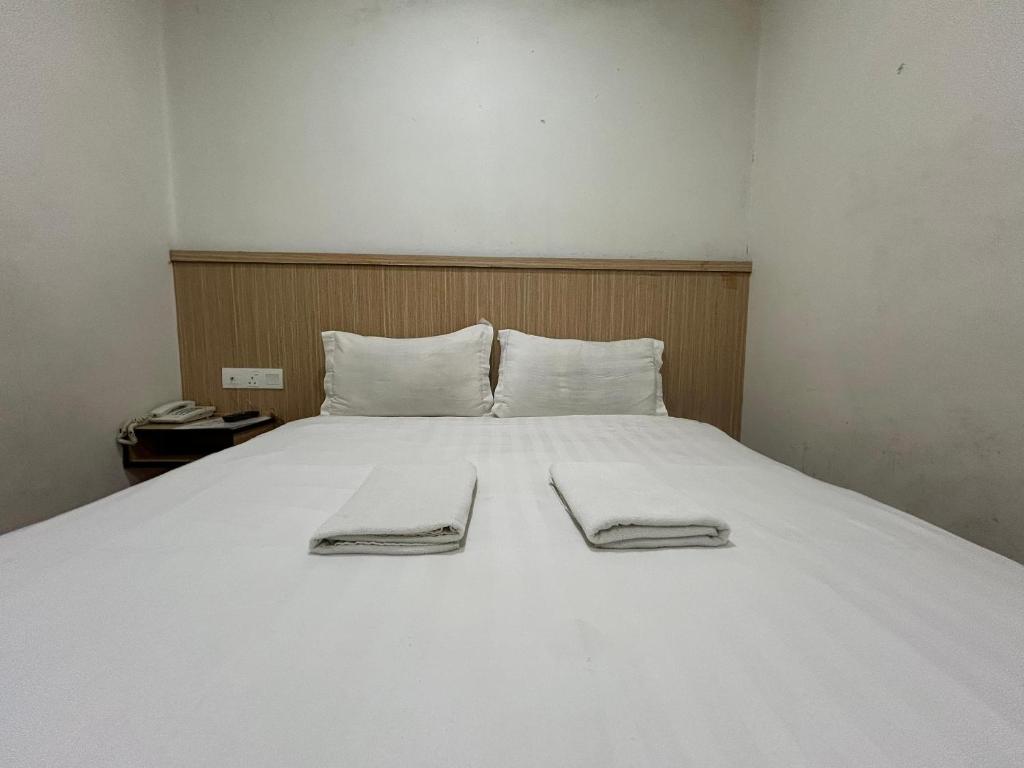 Postel nebo postele na pokoji v ubytování Mint Hotel