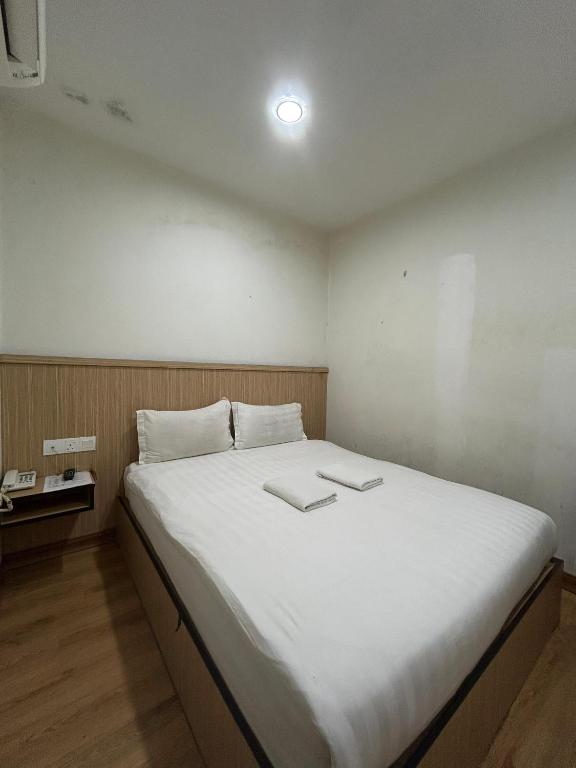 Postel nebo postele na pokoji v ubytování Mint Hotel