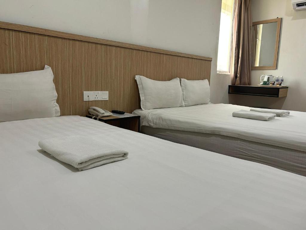 Postel nebo postele na pokoji v ubytování Mint Hotel