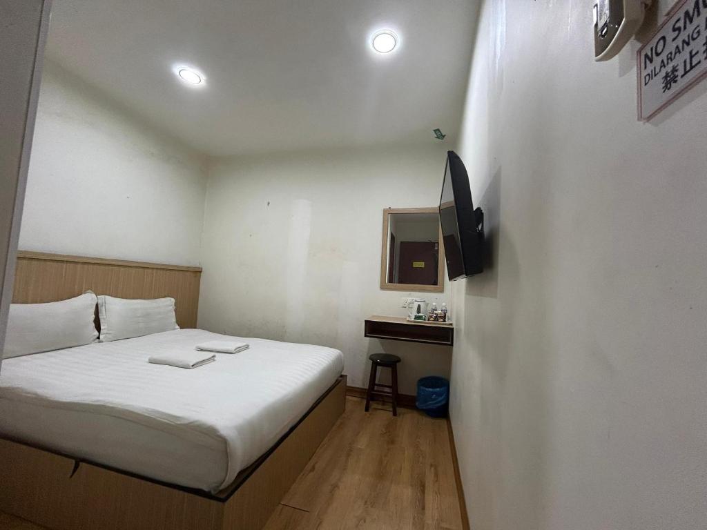 Postel nebo postele na pokoji v ubytování Mint Hotel