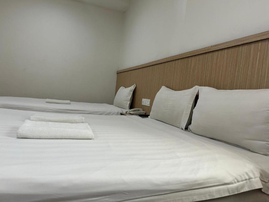 Postel nebo postele na pokoji v ubytování Mint Hotel