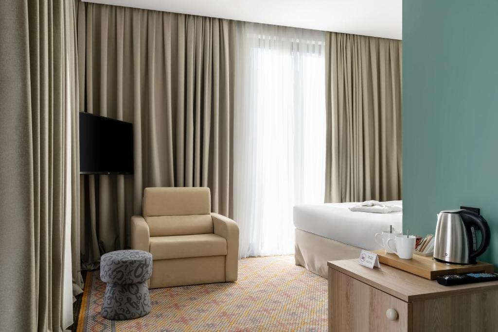 TV a/nebo společenská místnost v ubytování ibis Styles Old Tbilisi