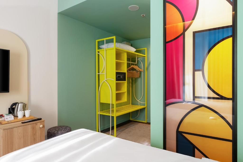 Postel nebo postele na pokoji v ubytování ibis Styles Old Tbilisi